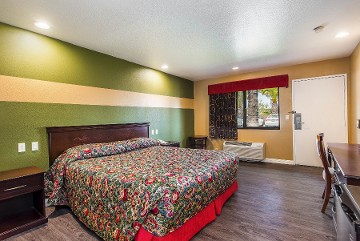 Bedroom with King Bed, night stands, and Air conditioner